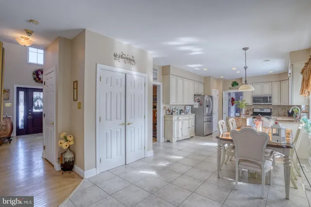 a kitchen with stainless steel appliances granite countertop a refrigerator sink and cabinets