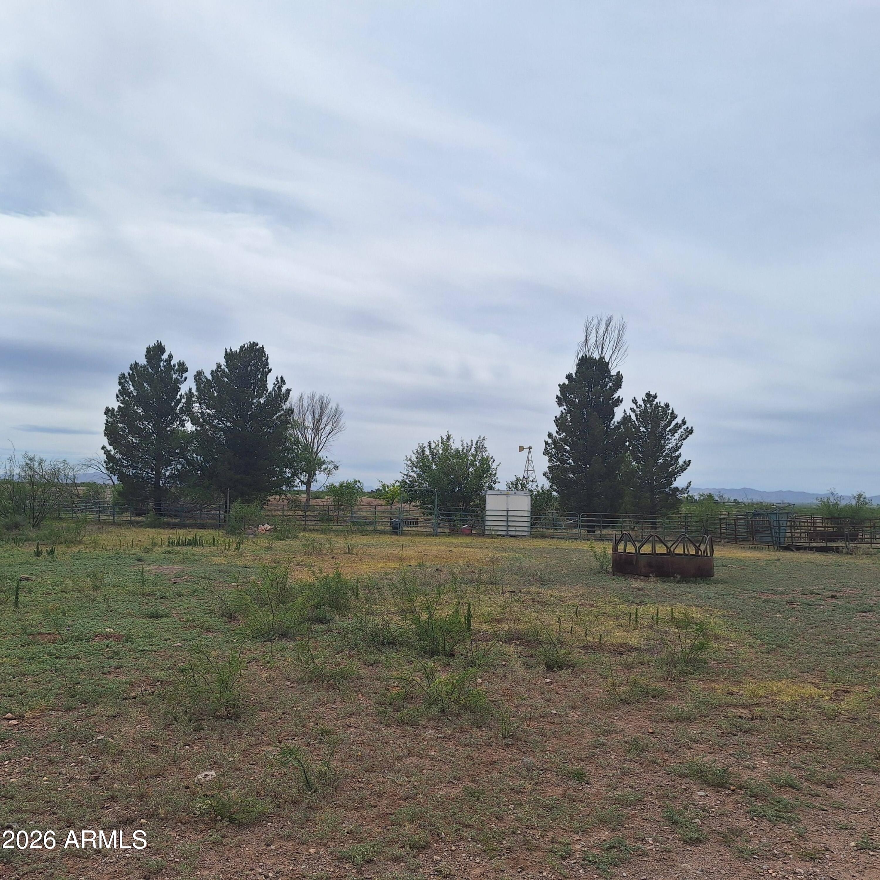 3470 West Double Adobe Road McNeal, AZ 85617 - Photo 5 of 23 a view of a field with trees in background