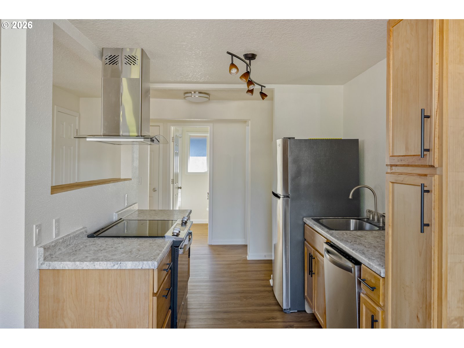 500 Depot Street Fairview, OR 97024 - Photo 14 of 28 a kitchen with refrigerator cabinets and wooden floor