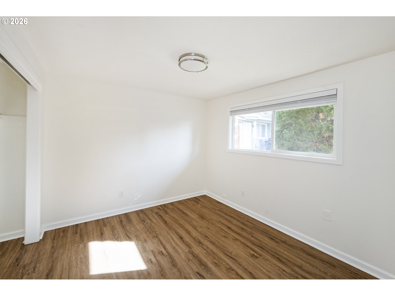 500 Depot Street Fairview, OR 97024 - Photo 20 of 28 a view of an empty room with wooden floor and a window
