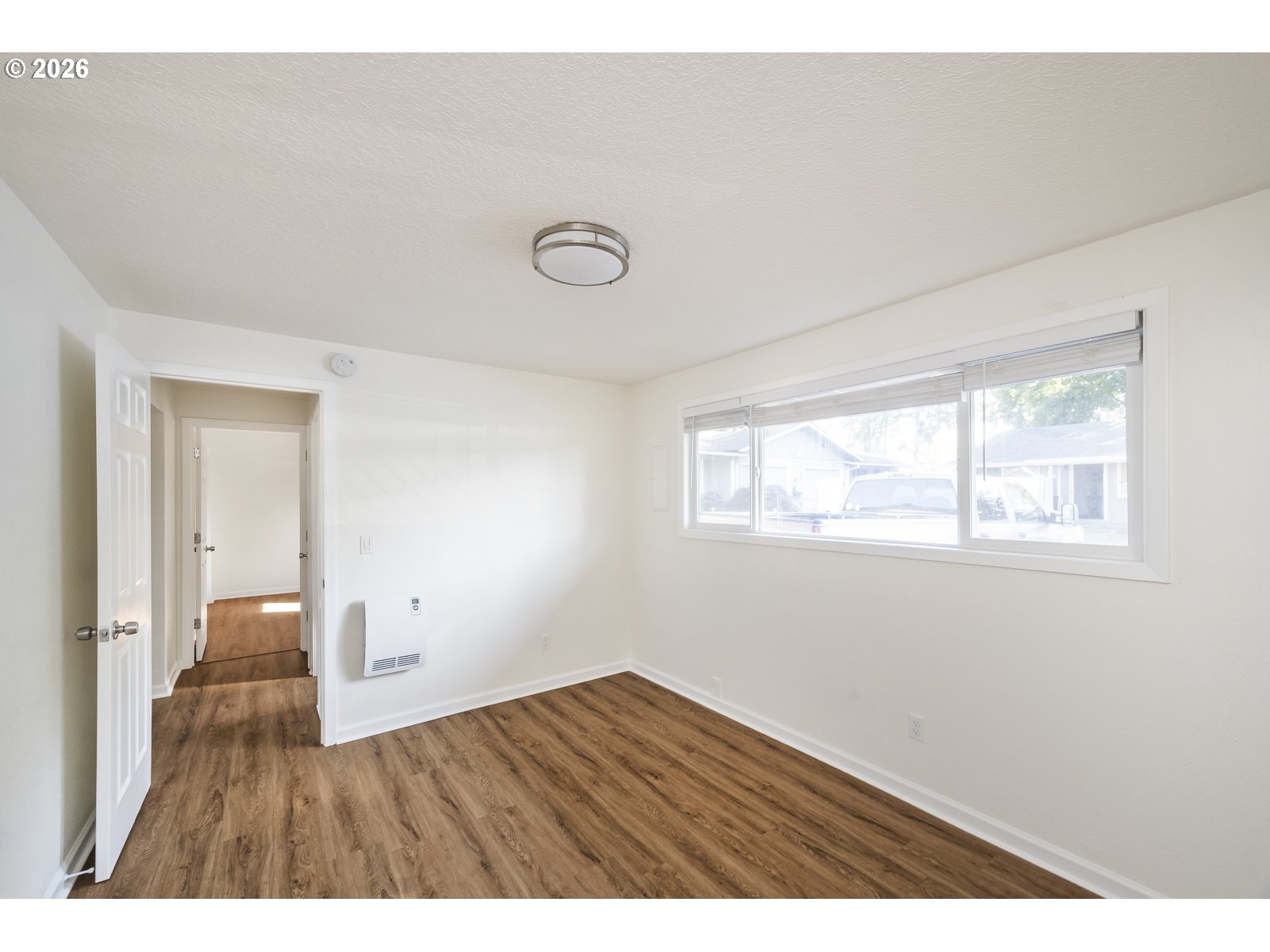 500 Depot Street Fairview, OR 97024 - Photo 23 of 28 a view of an empty room with wooden floor and a window