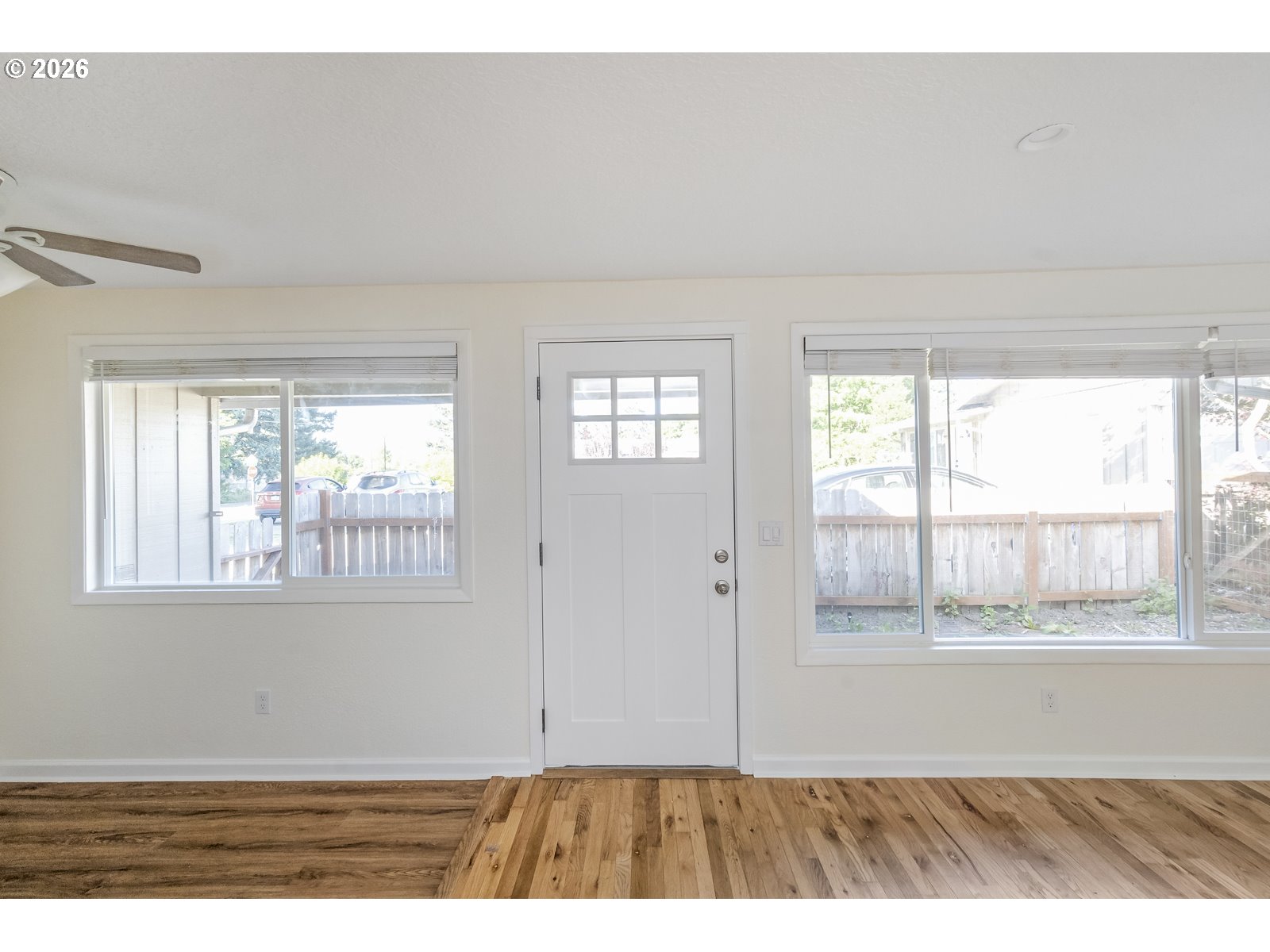 500 Depot Street Fairview, OR 97024 - Photo 7 of 28 a view of an empty room with wooden floor and a window