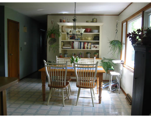 388 Burts Pit Road Northampton, MA 01062 - Photo 4 of 14 a dining room with furniture potted plants and wooden floor