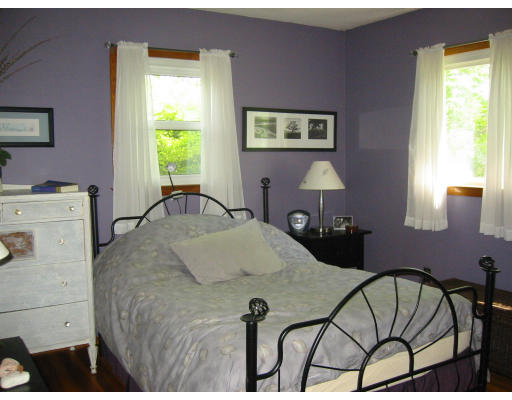 388 Burts Pit Road Northampton, MA 01062 - Photo 7 of 14 a bedroom with a bed and a table