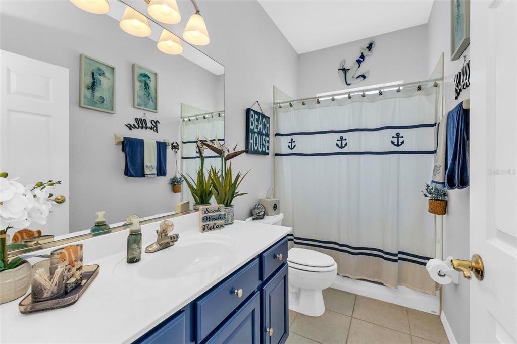 24439 Buckingham Way Punta Gorda, FL 33980 - Photo 18 of 42 a bathroom with a sink toilet and shower