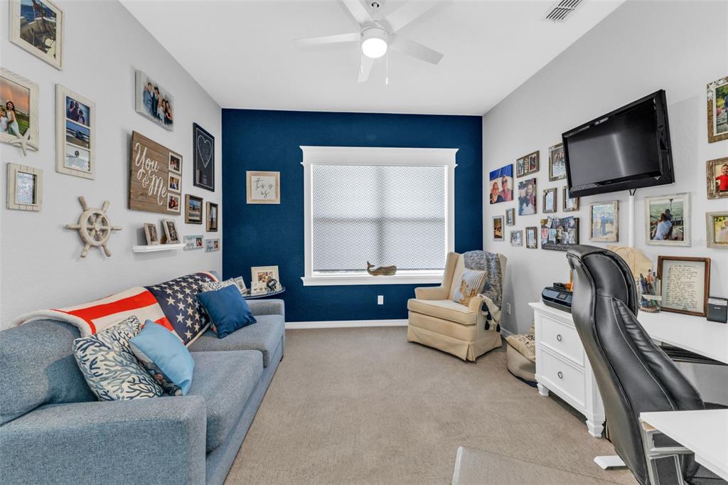 24439 Buckingham Way Punta Gorda, FL 33980 - Photo 19 of 42 a living room with furniture and a flat screen tv
