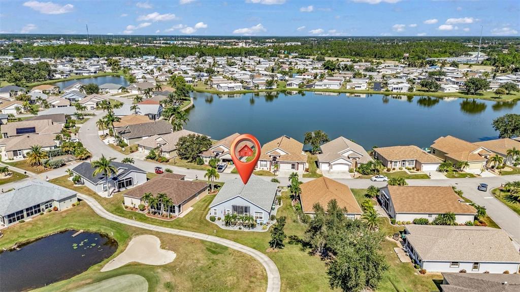 24439 Buckingham Way Punta Gorda, FL 33980 - Photo 21 of 42 an aerial view of residential houses with outdoor space