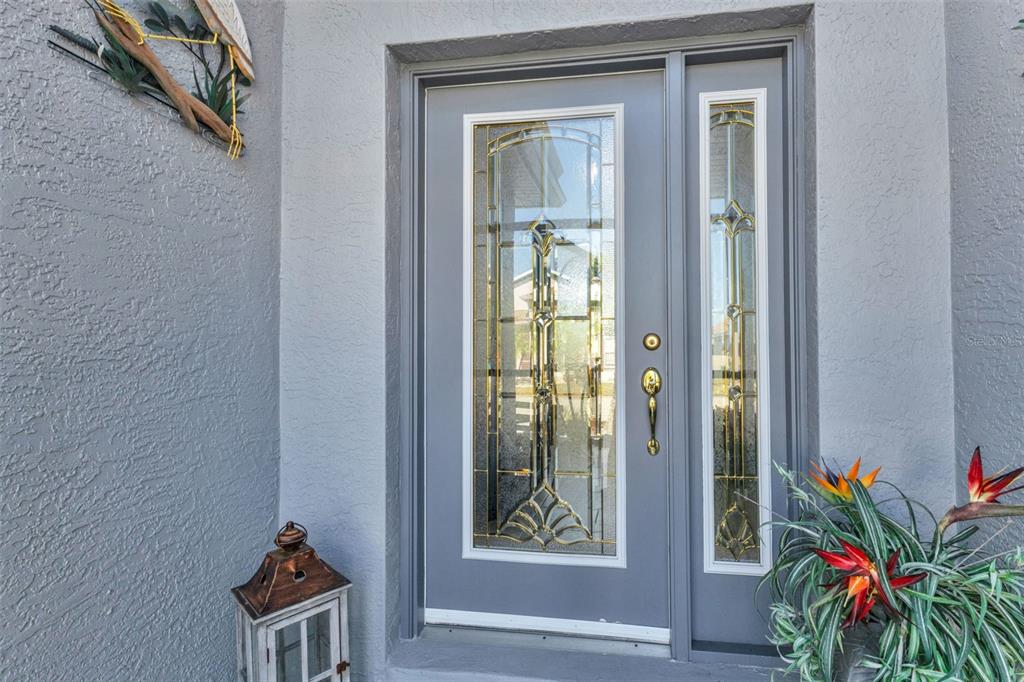 24439 Buckingham Way Punta Gorda, FL 33980 - Photo 3 of 42 a house with potted plant in front of it