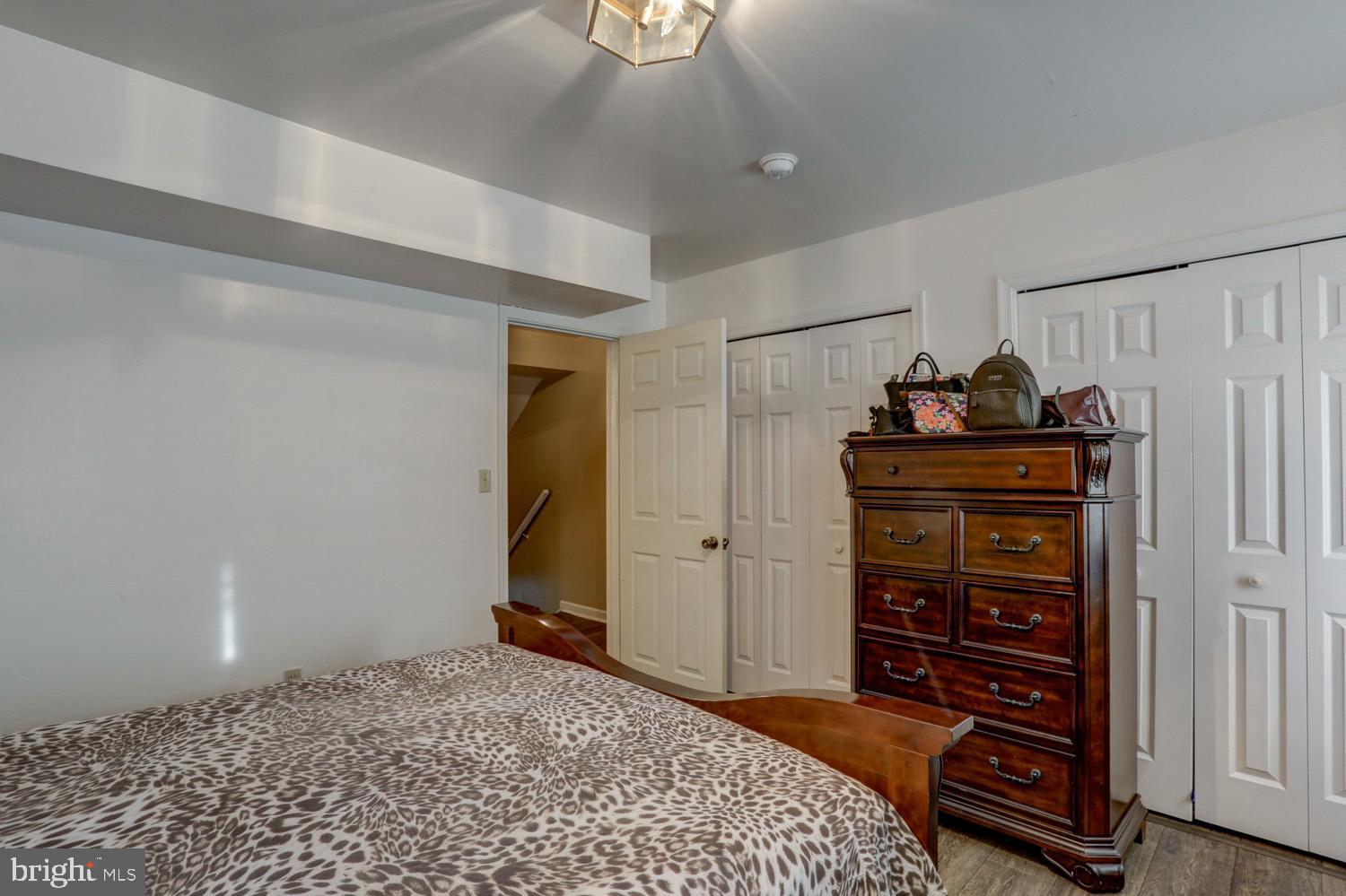 417 Green Street Lancaster, PA 17602 - Photo 26 of 37 a bedroom with a dresser and a chandelier