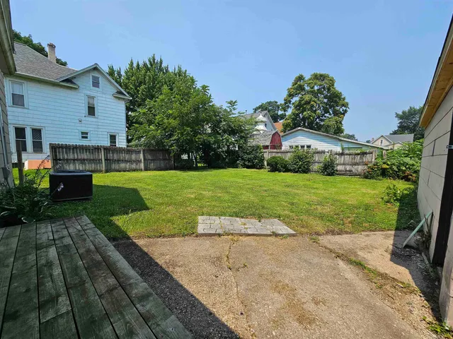 a view of a backyard with a garden and plants