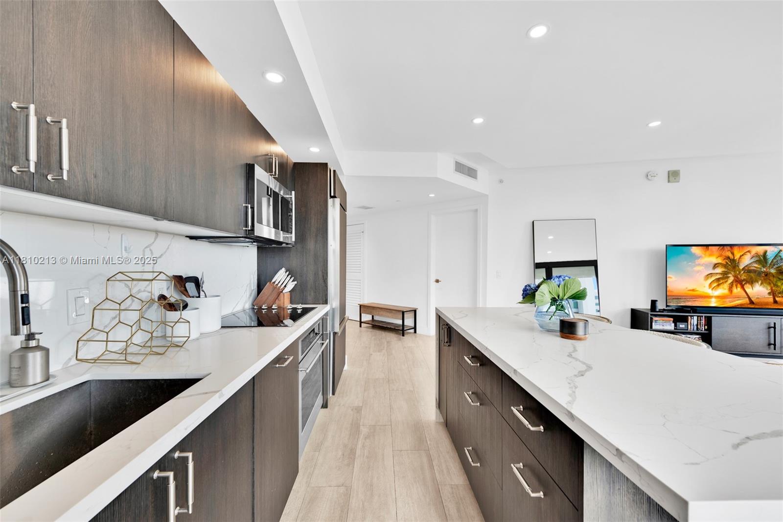 121 Northeast 34th Street, Unit L304 Miami, FL 33137 - Photo 15 of 36 a kitchen with lots of counter top space