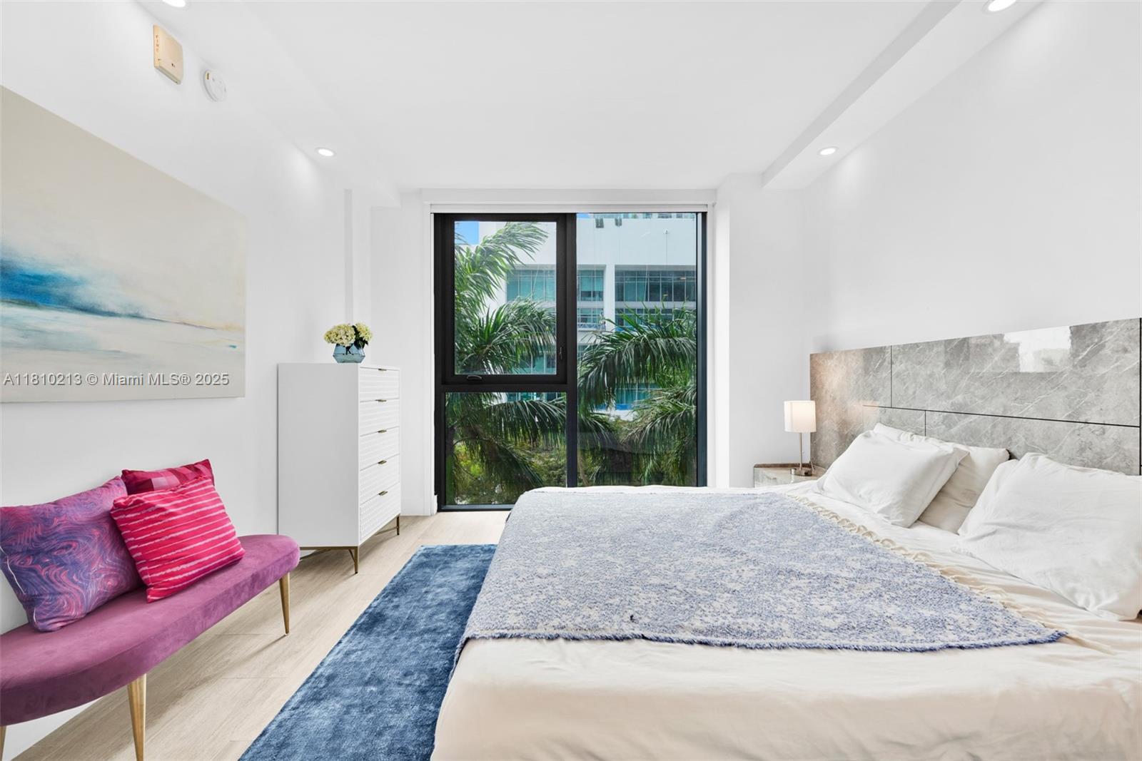 121 Northeast 34th Street, Unit L304 Miami, FL 33137 - Photo 17 of 36 a living room with furniture and a large window
