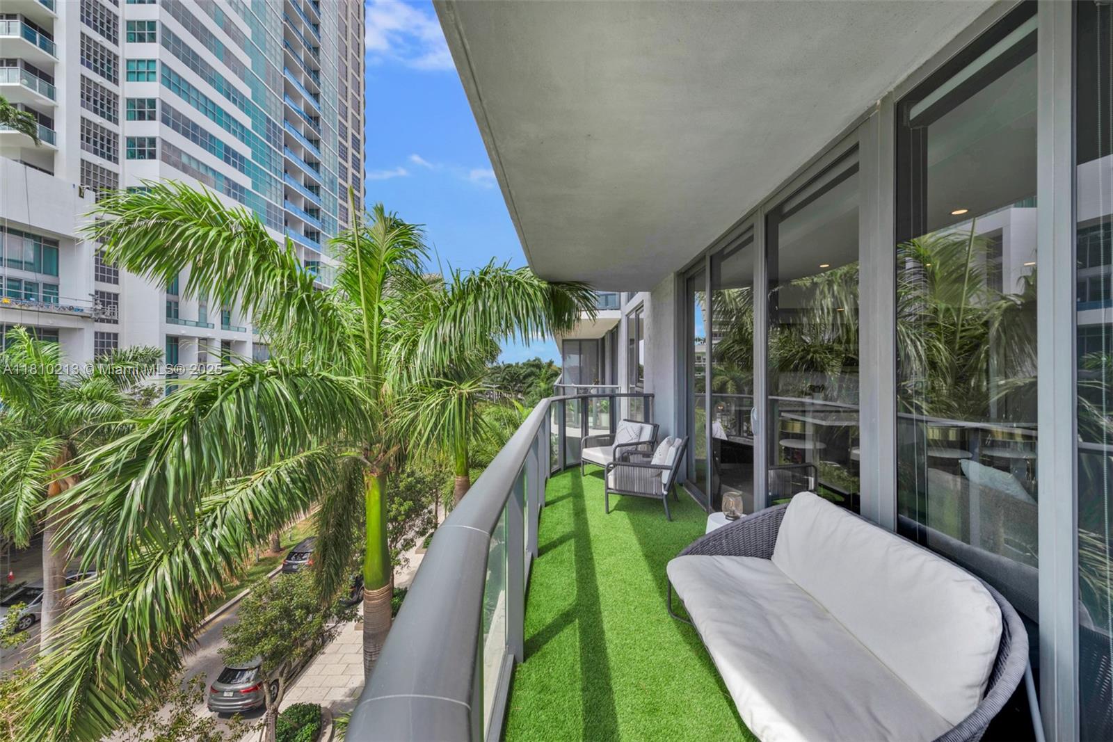 121 Northeast 34th Street, Unit L304 Miami, FL 33137 - Photo 33 of 36 a garden view with a seating space