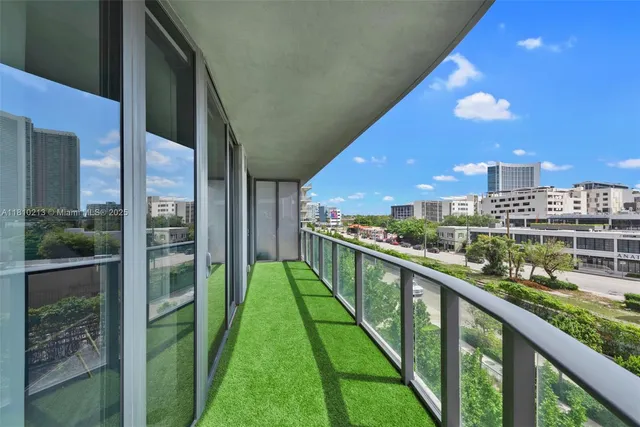 a view of swimming pool from a balcony