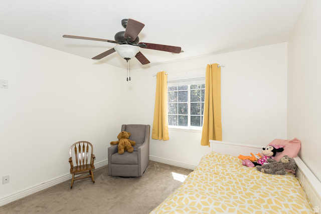 7797 North Windhover Road Eagle Mountain, UT 84005 - Photo 22 of 33 Bedroom featuring a ceiling fan with integrated lighting, a window with exterior views, white baseboards, and neutral wall paint