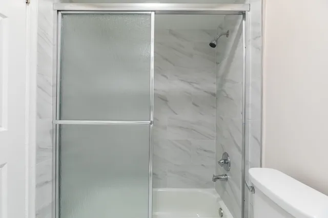 a view of a backyard with a table and chairs