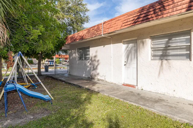 a view of a backyard with a slide