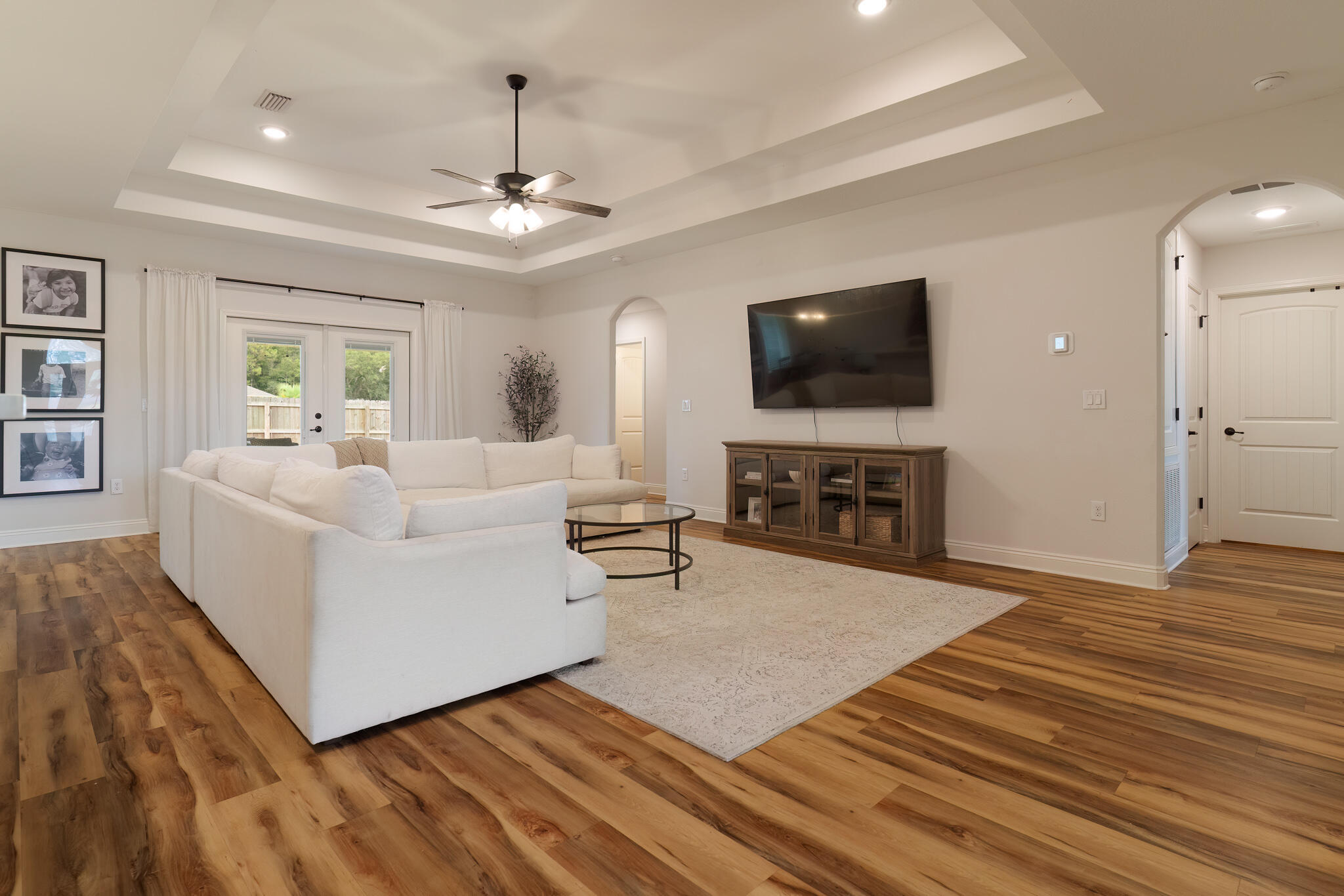 9180 Tara Circle Milton, FL 32583 - Photo 12 of 56 a living room with furniture a flat screen tv and a fireplace