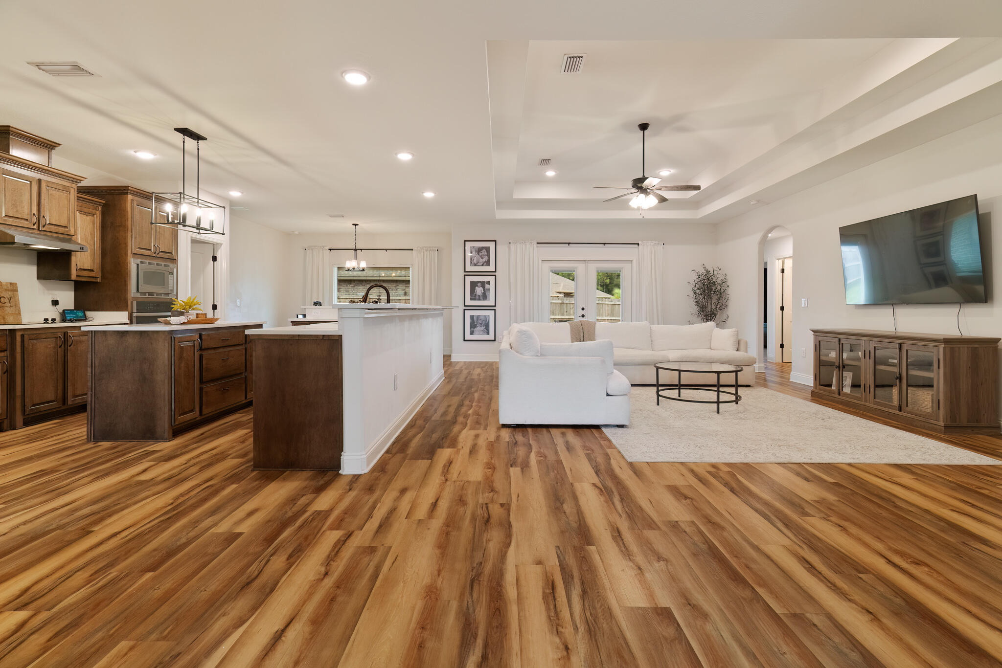 9180 Tara Circle Milton, FL 32583 - Photo 13 of 56 a large room with wooden floor and furniture