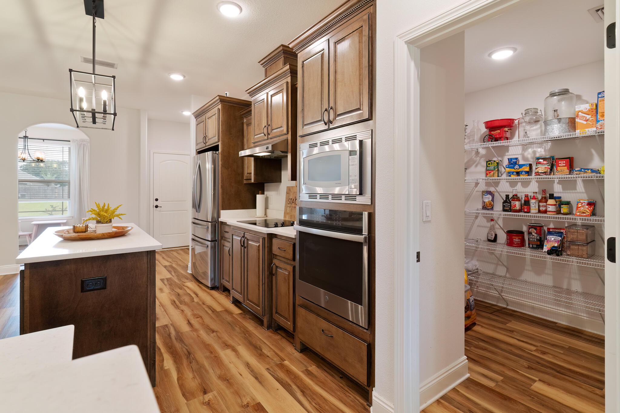 9180 Tara Circle Milton, FL 32583 - Photo 16 of 56 a kitchen with refrigerator and cabinets