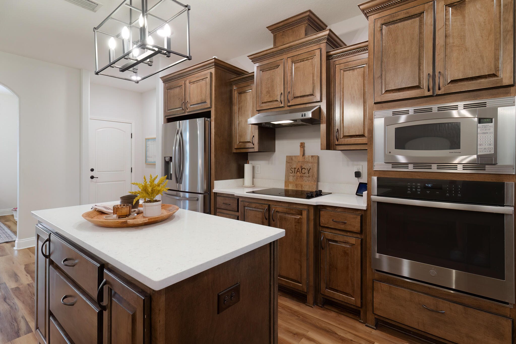 9180 Tara Circle Milton, FL 32583 - Photo 19 of 56 a kitchen with stainless steel appliances granite countertop a sink stove and refrigerator