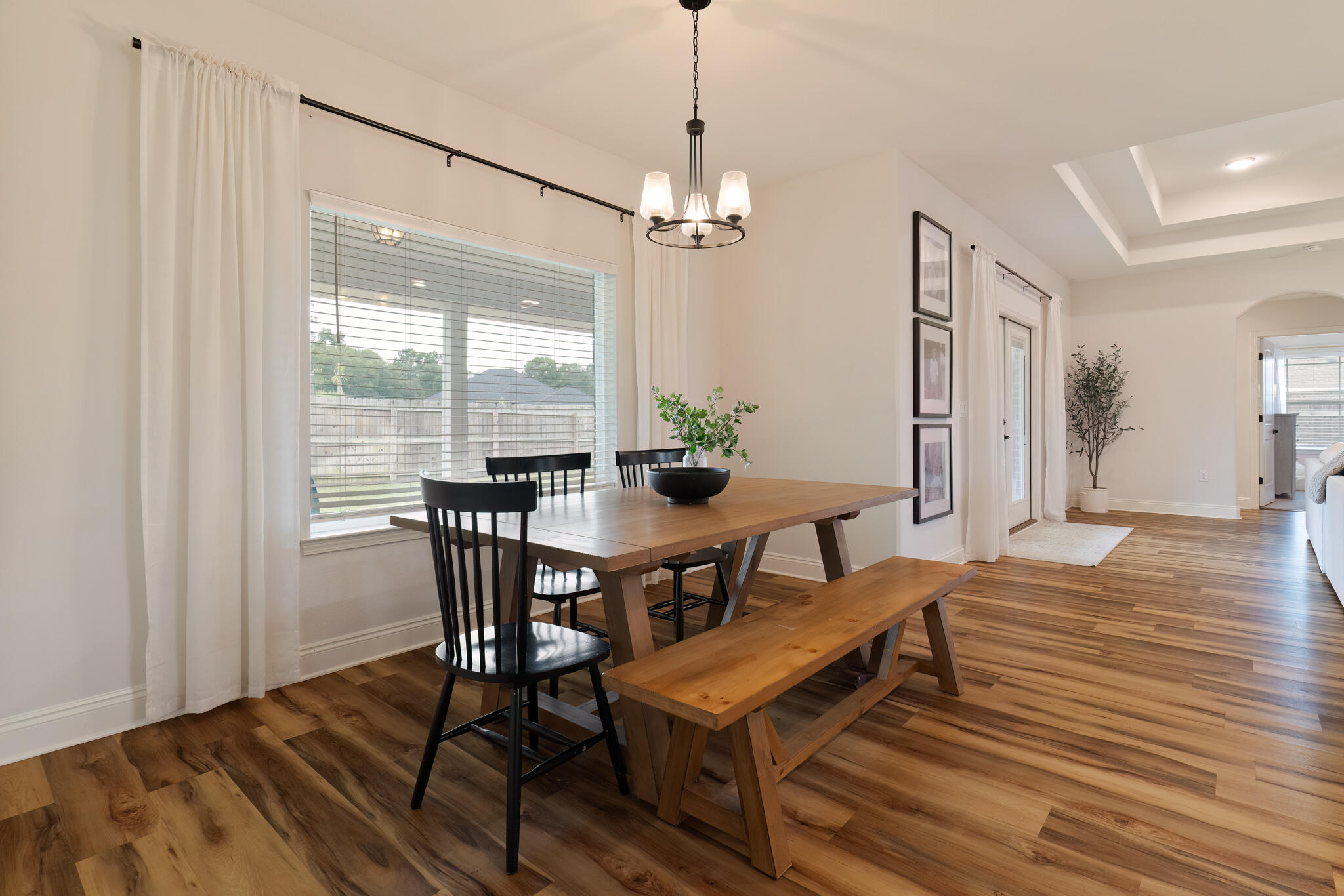 9180 Tara Circle Milton, FL 32583 - Photo 22 of 56 a view of a dining room with furniture window and wooden floor