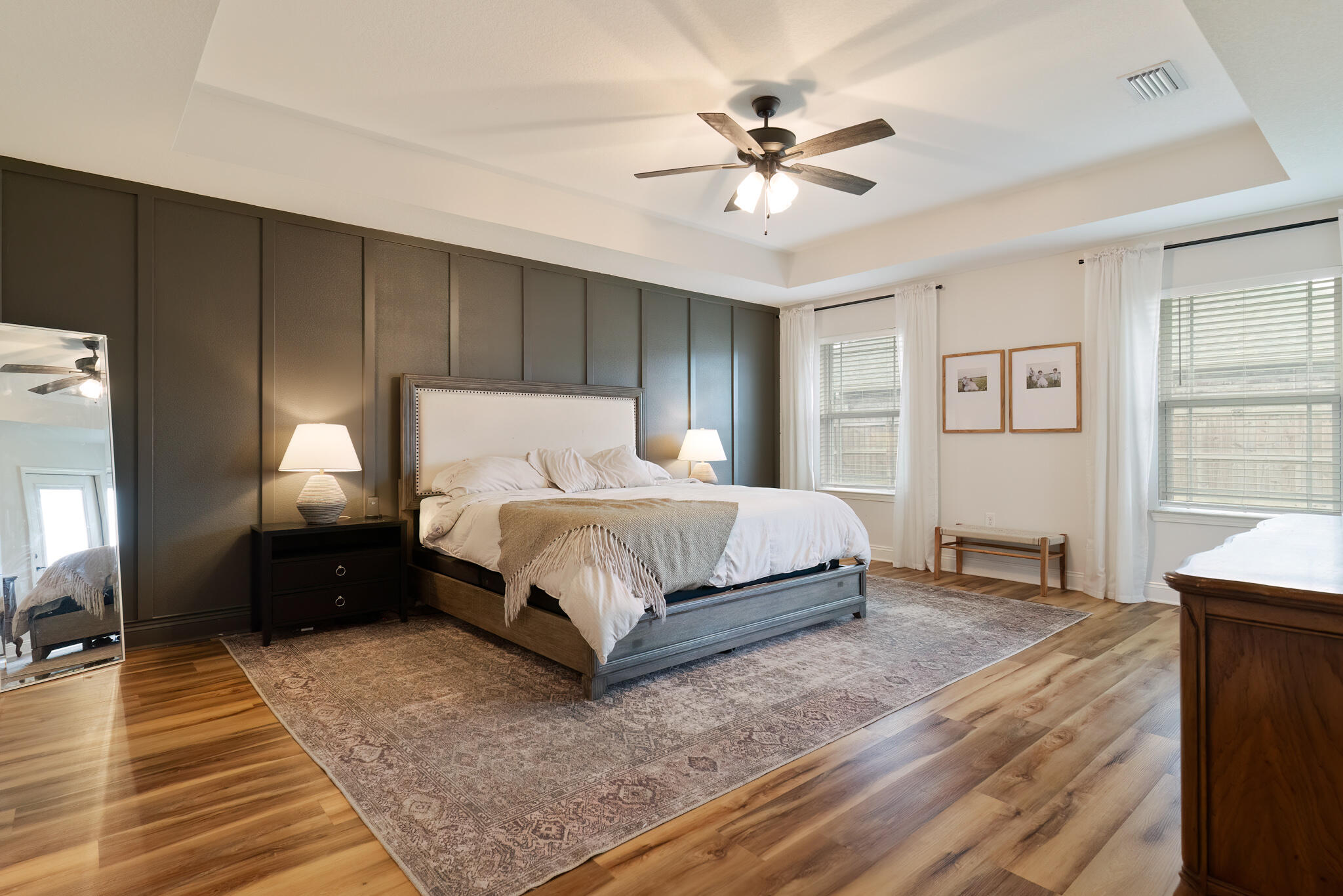 9180 Tara Circle Milton, FL 32583 - Photo 24 of 56 a bedroom with a bed lamp closet and three large window