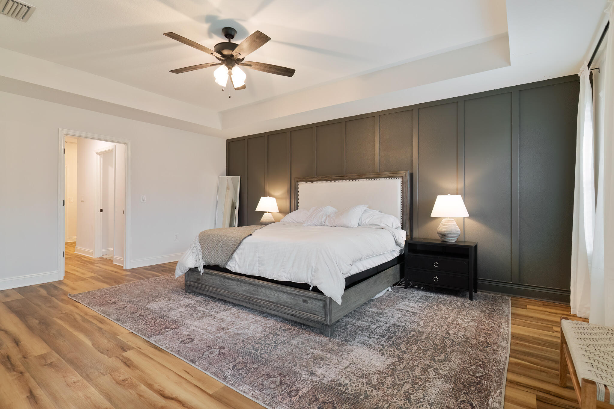 9180 Tara Circle Milton, FL 32583 - Photo 25 of 56 a bedroom with a bed and a chandelier