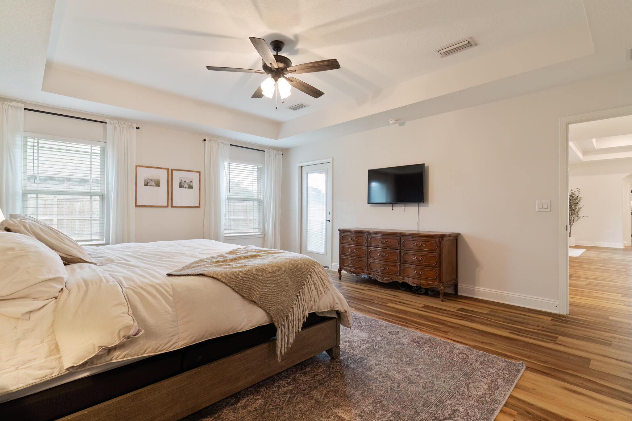 9180 Tara Circle Milton, FL 32583 - Photo 26 of 56 a bedroom with a bed and a flat screen tv