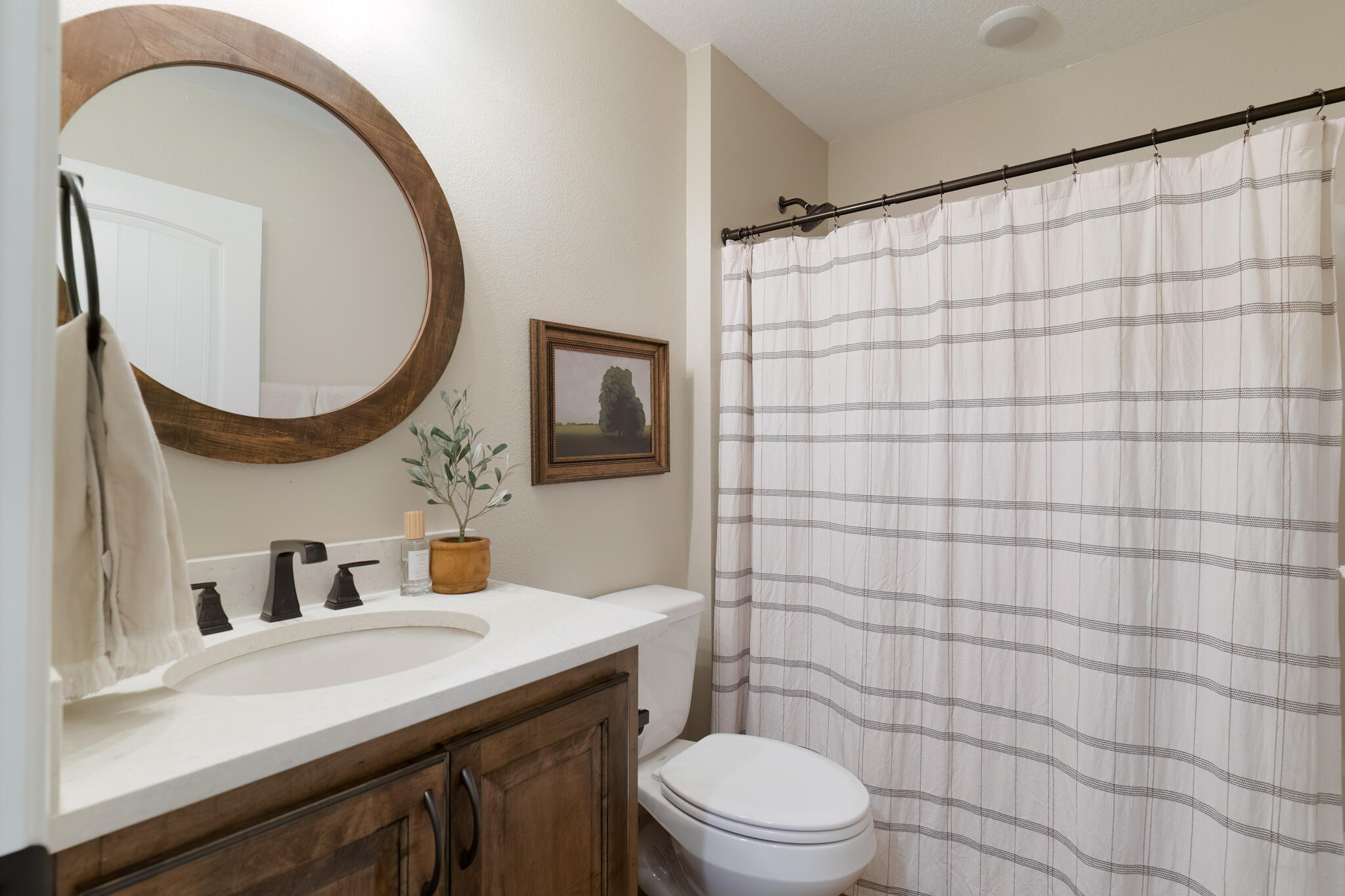 9180 Tara Circle Milton, FL 32583 - Photo 34 of 56 a bathroom with a sink a toilet and a mirror
