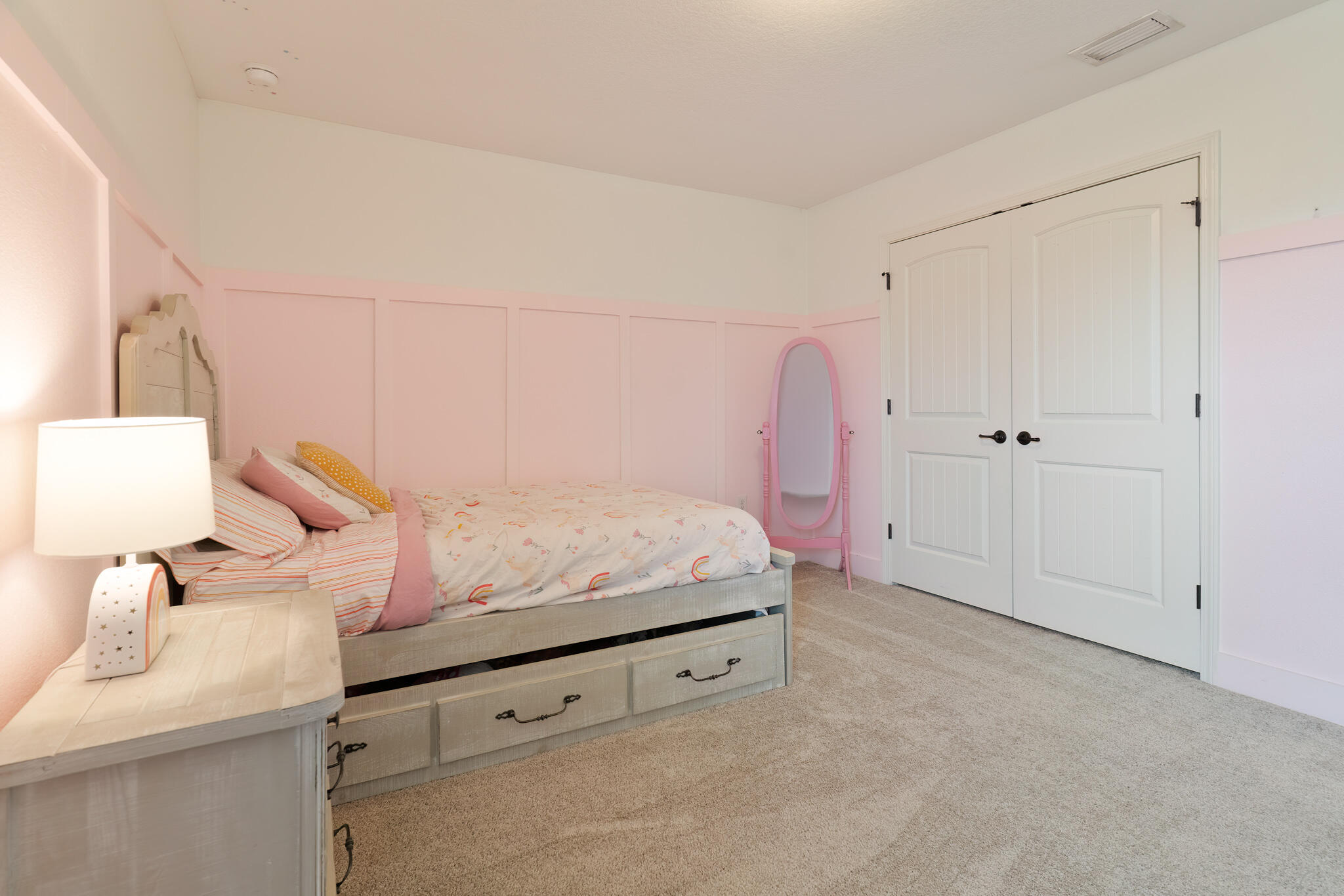 9180 Tara Circle Milton, FL 32583 - Photo 38 of 56 a room with a bed and a cabinets