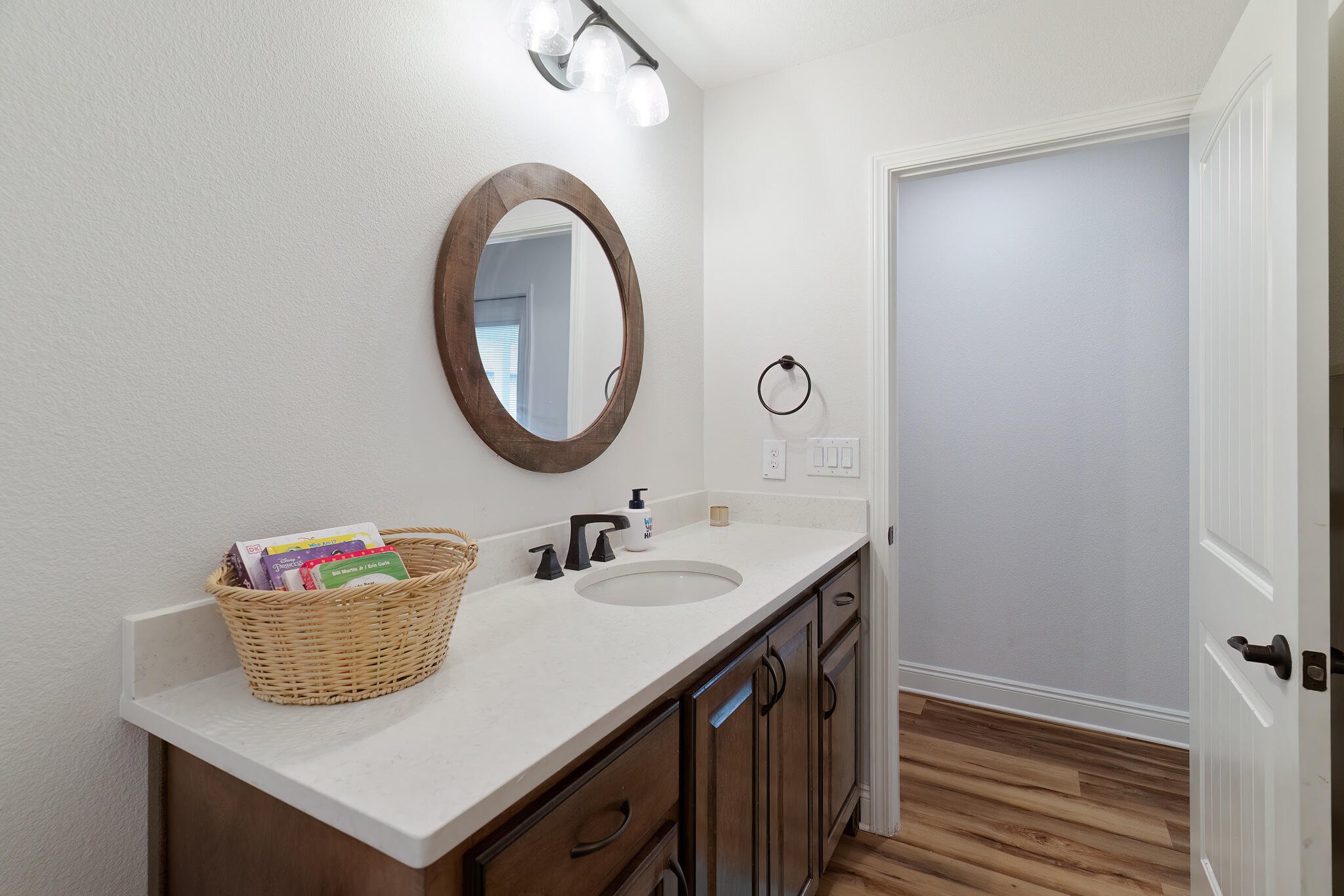 9180 Tara Circle Milton, FL 32583 - Photo 40 of 56 a bathroom with a sink a vanity and a mirror