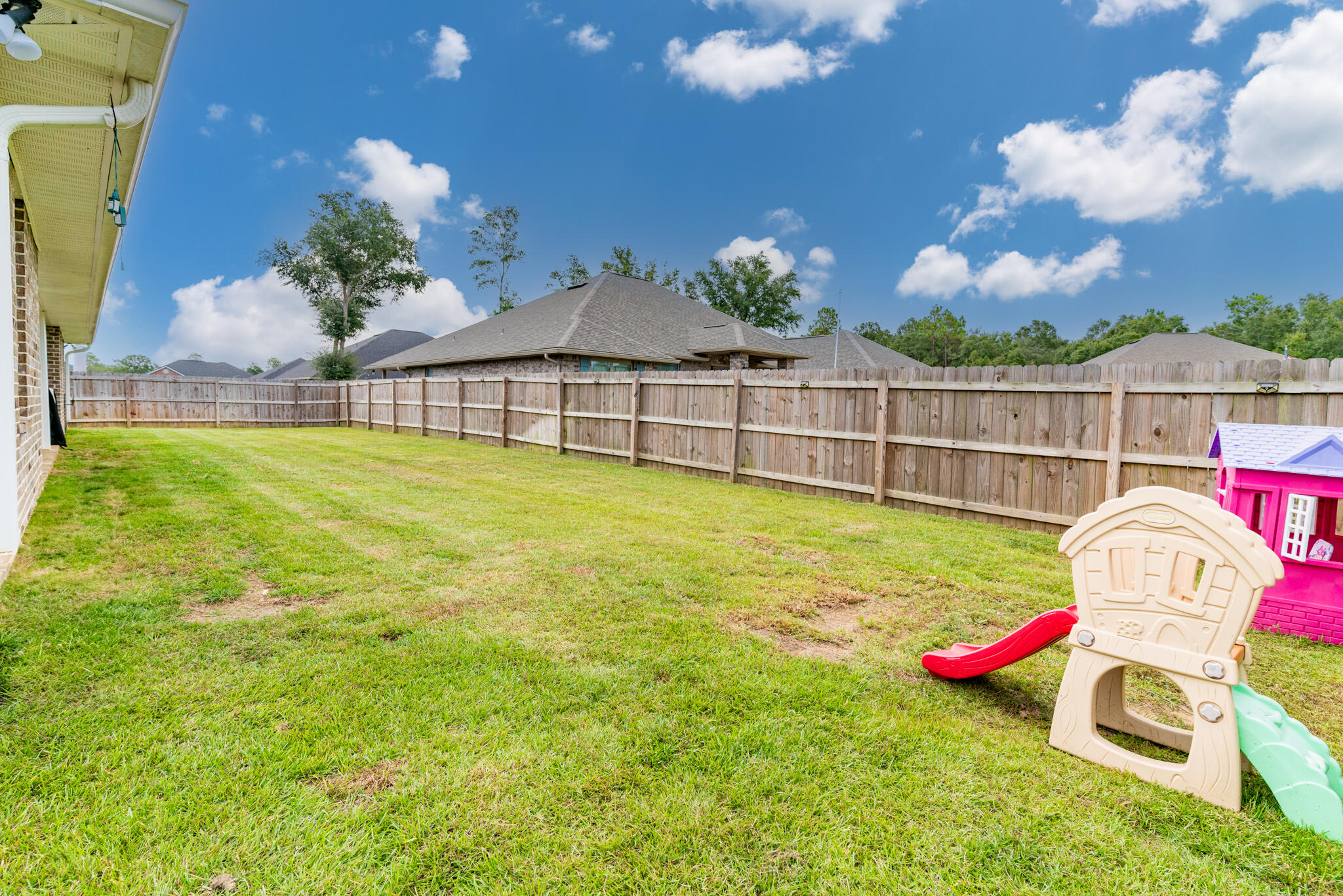 9180 Tara Circle Milton, FL 32583 - Photo 44 of 56 a view of a backyard with swimming pool