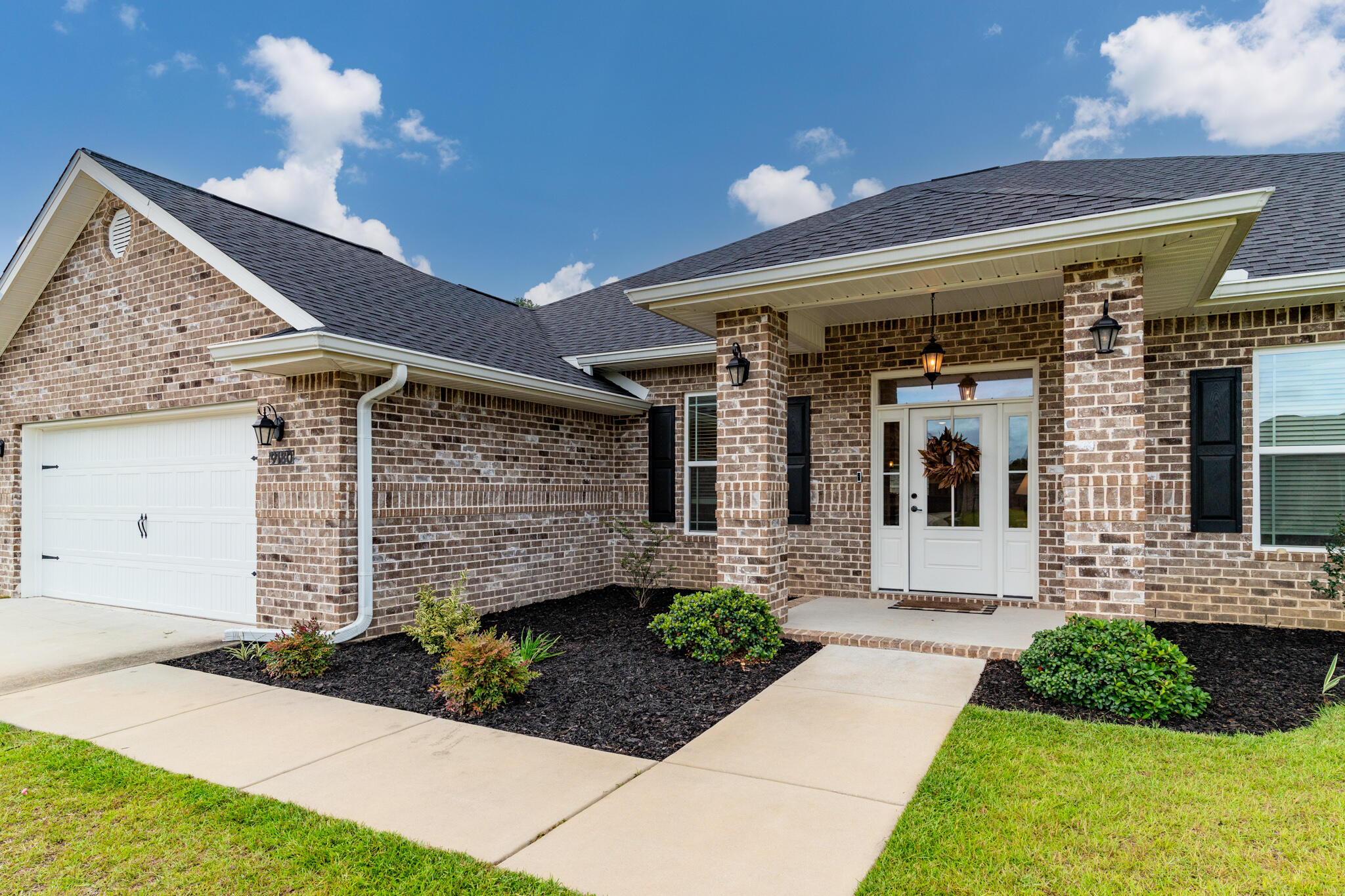 9180 Tara Circle Milton, FL 32583 - Photo 6 of 56 a front view of a house with a yard