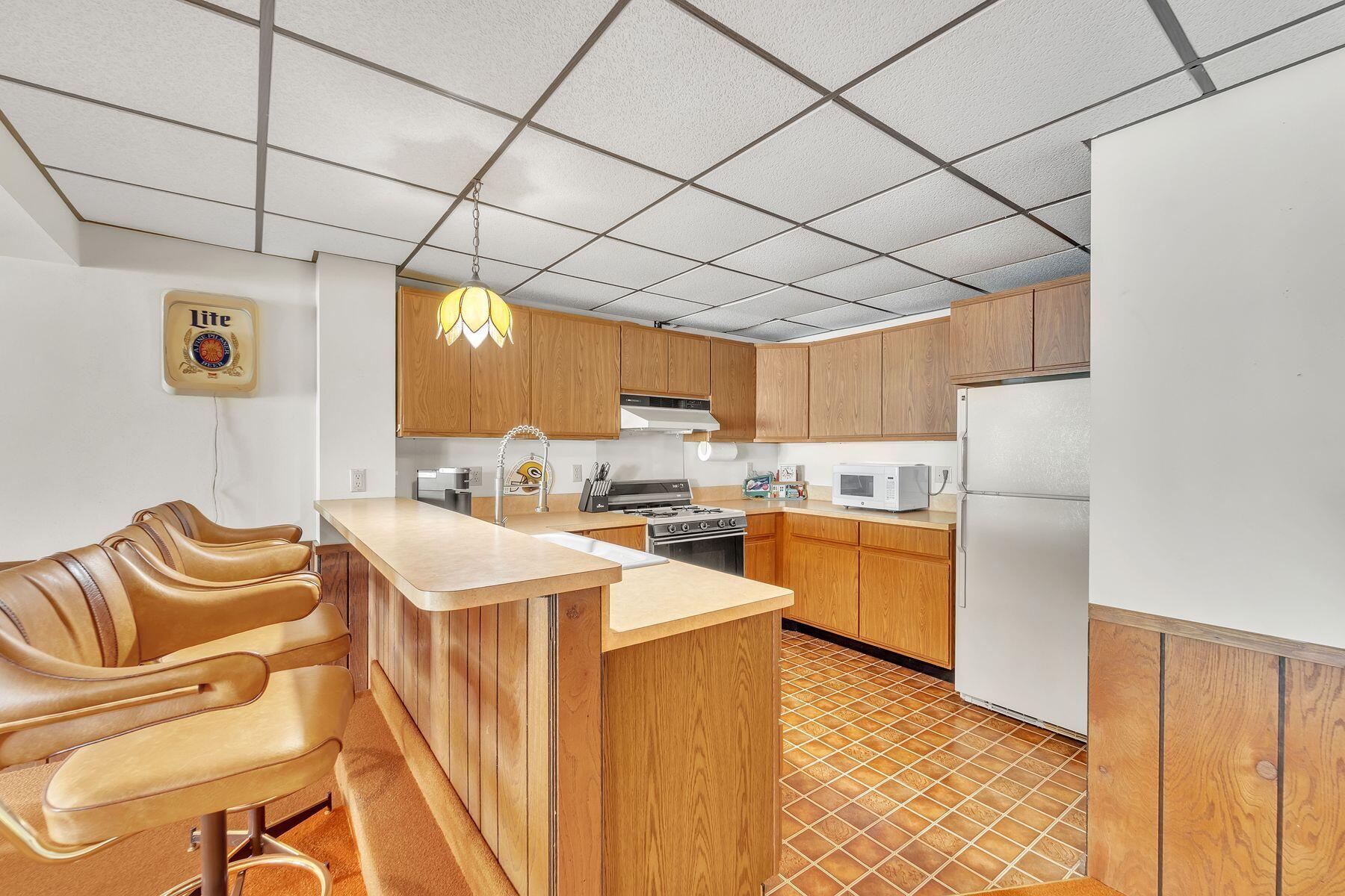 N64W35061 Rd J Oconomowoc, WI 53066 - Photo 23 of 36 Second Kitchen Downstairs