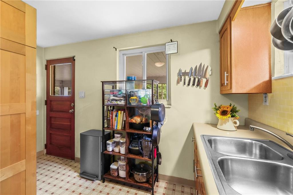 1654 Hollyrood Road Pittsburgh, PA 15227 - Photo 24 of 33 a kitchen with a refrigerator and a sink