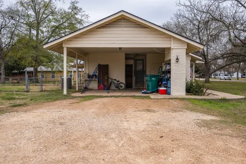 a view of a house with a big yard