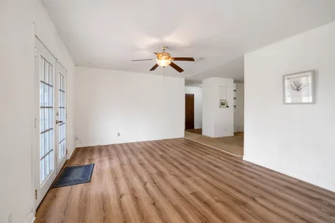 a kitchen with stainless steel appliances and white cabinets