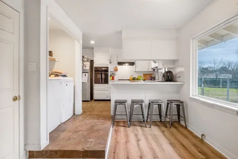 a kitchen with a sink and cabinets
