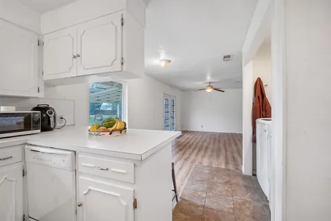 a kitchen with stainless steel appliances a refrigerator and a stove top oven