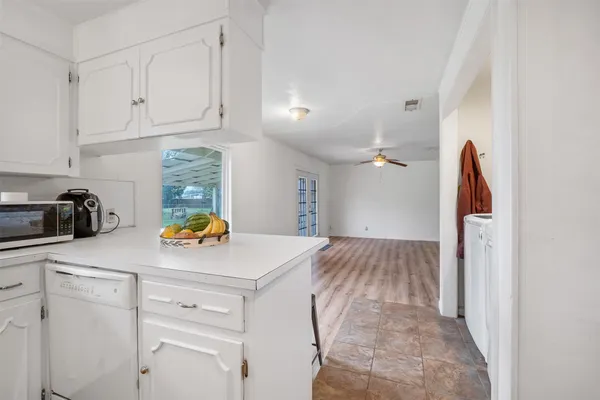 a kitchen with stainless steel appliances a refrigerator and a stove top oven