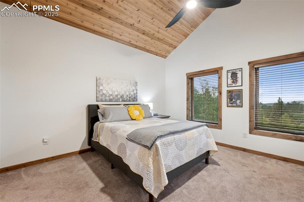 103 Copper Mountain Drive Cripple Creek, CO 80813 - Photo 18 of 29 a bed sitting in a spacious bedroom next to a window