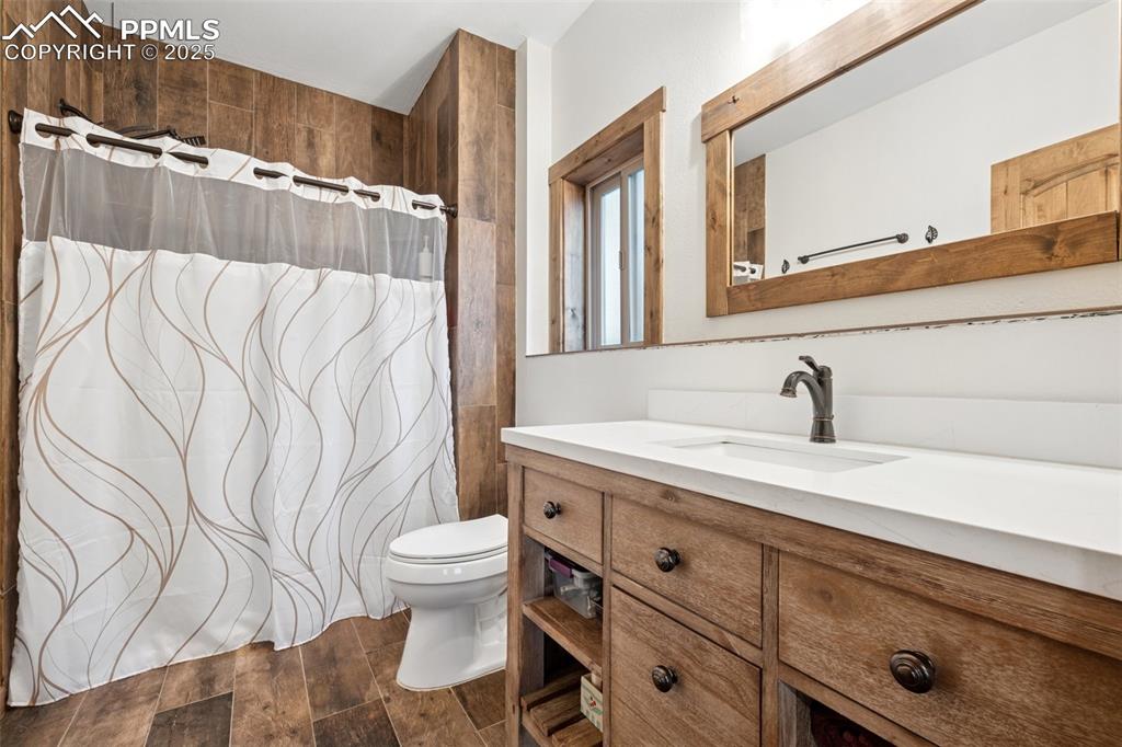 103 Copper Mountain Drive Cripple Creek, CO 80813 - Photo 20 of 29 a bathroom with a sink and a mirror