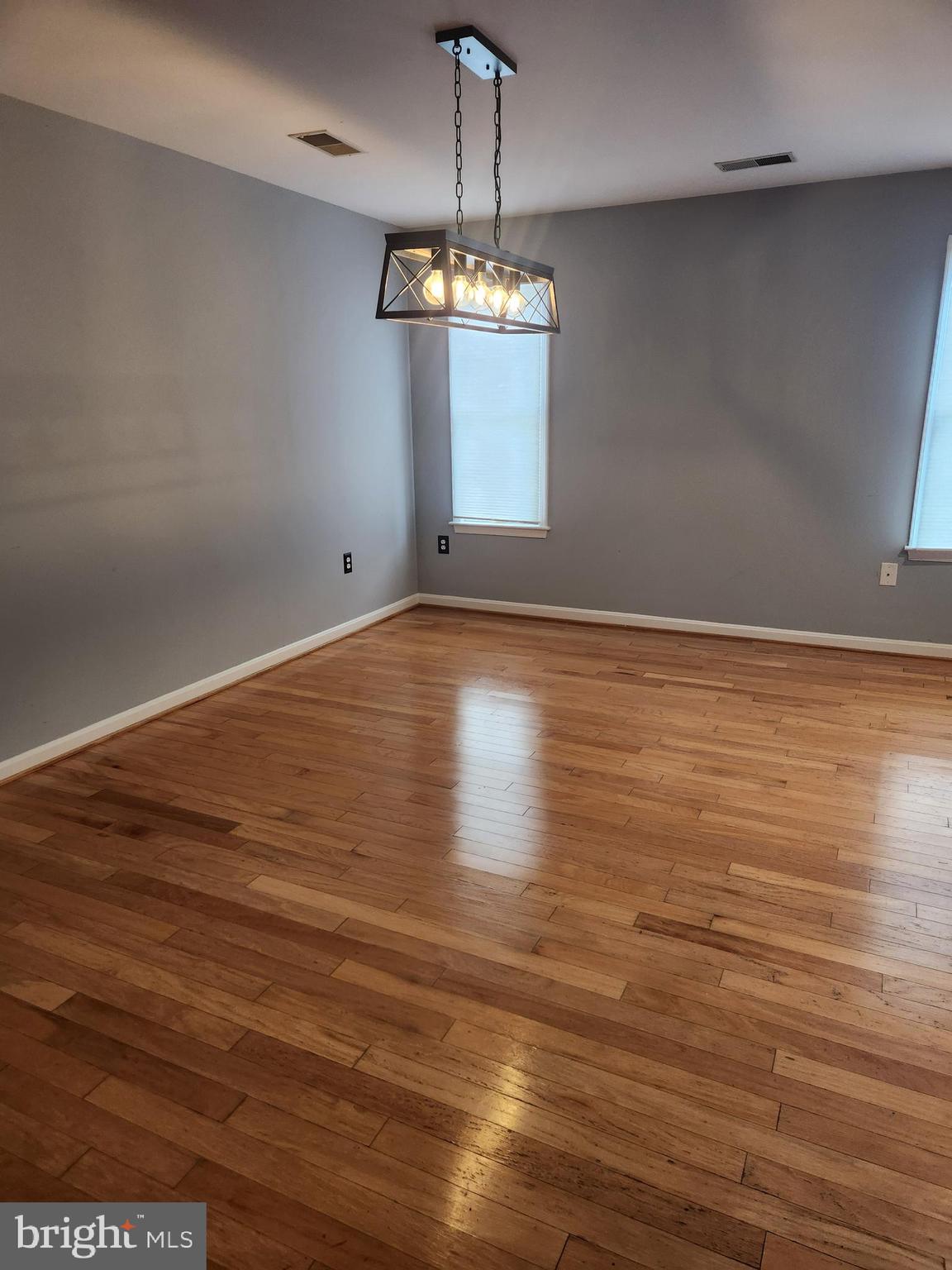 239 Morningside Drive Falling Waters, WV 25419 - Photo 6 of 20 a view of an empty room with wooden floor and a window