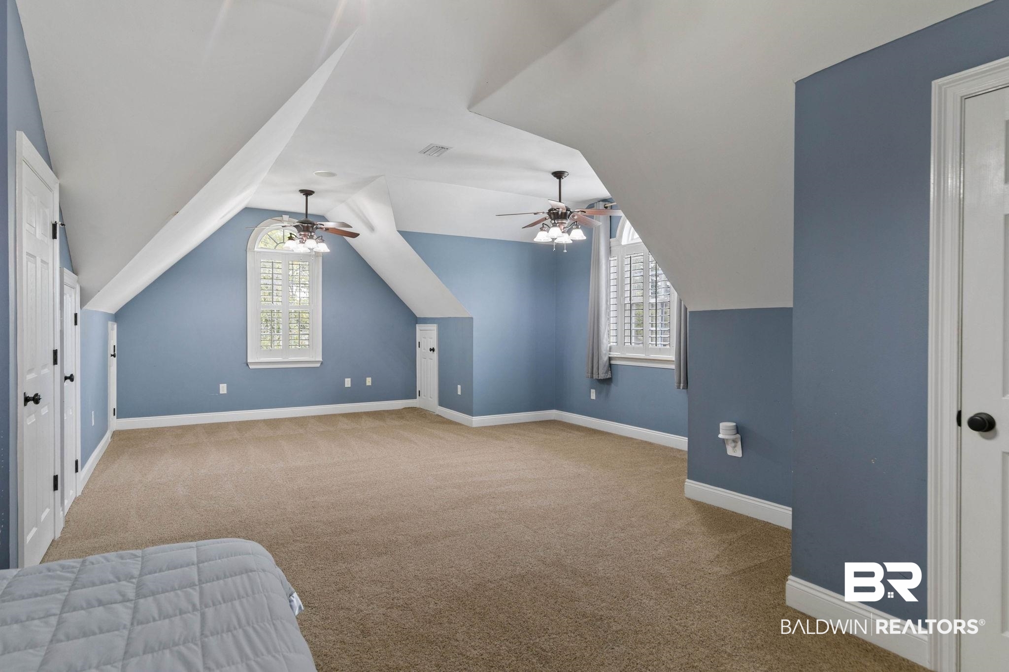 3668 Claridge Road North Mobile, AL 36608 - Photo 76 of 100 Bonus room featuring light colored carpet, vaulted ceiling, healthy amount of natural light, and a ceiling fan