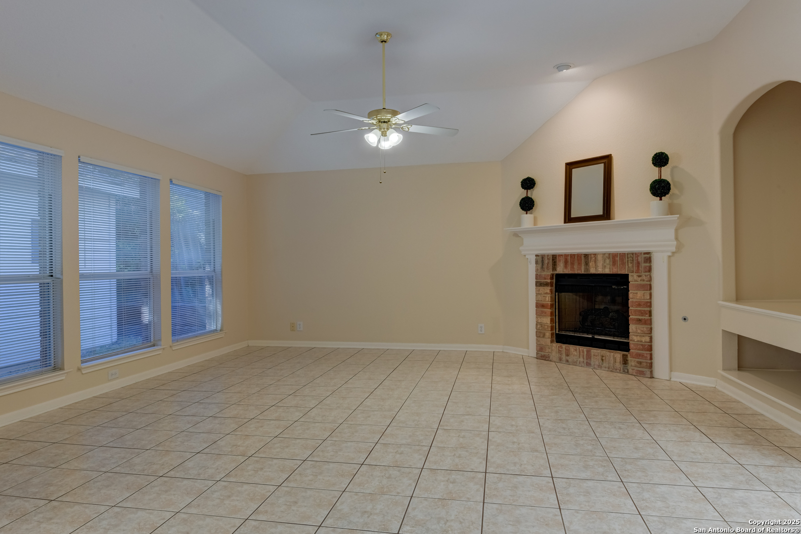 9923 Tezel Road San Antonio, TX 78254 - Photo 11 of 30 a view of an empty room with a fireplace