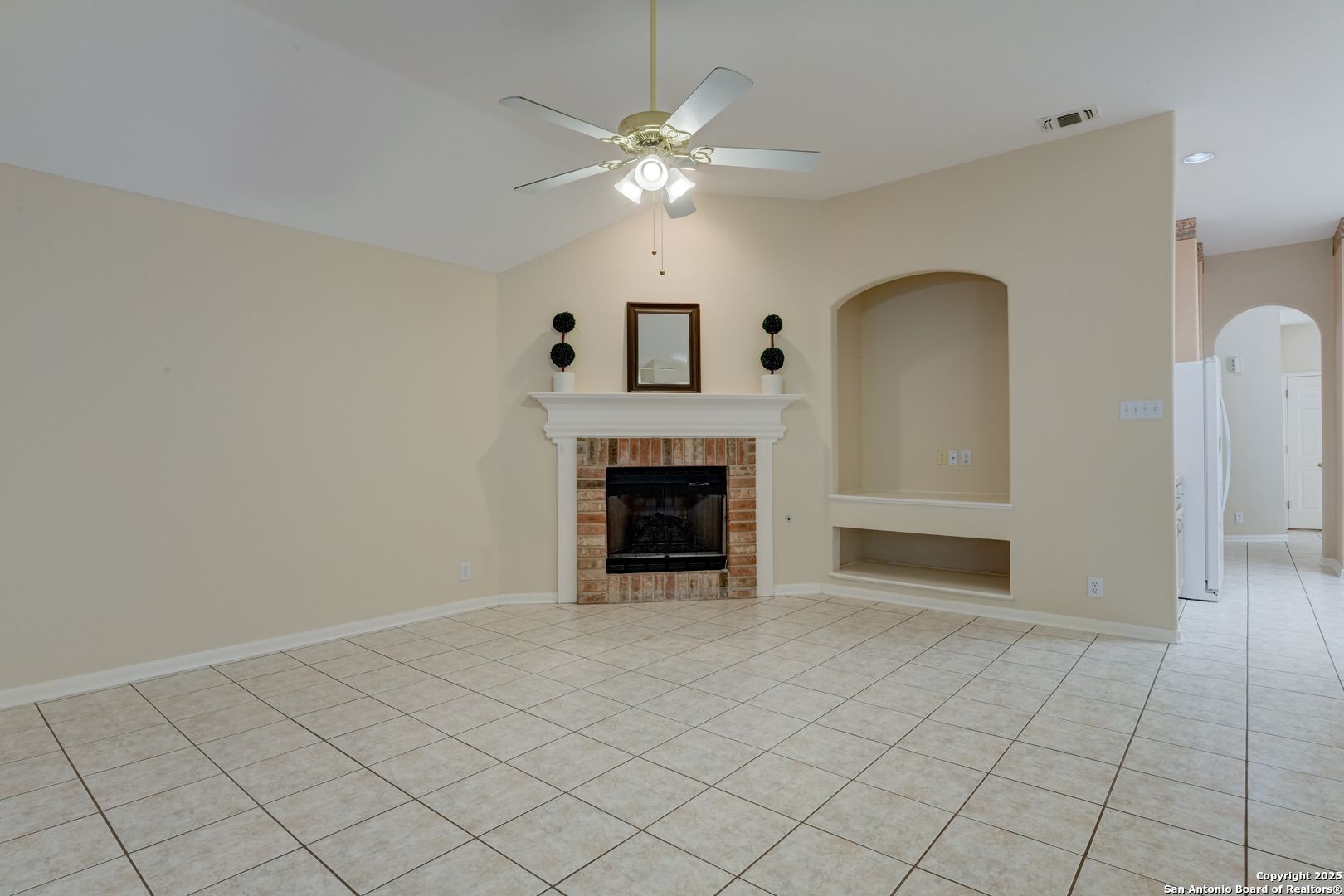 9923 Tezel Road San Antonio, TX 78254 - Photo 12 of 30 a view of an empty room with a fireplace