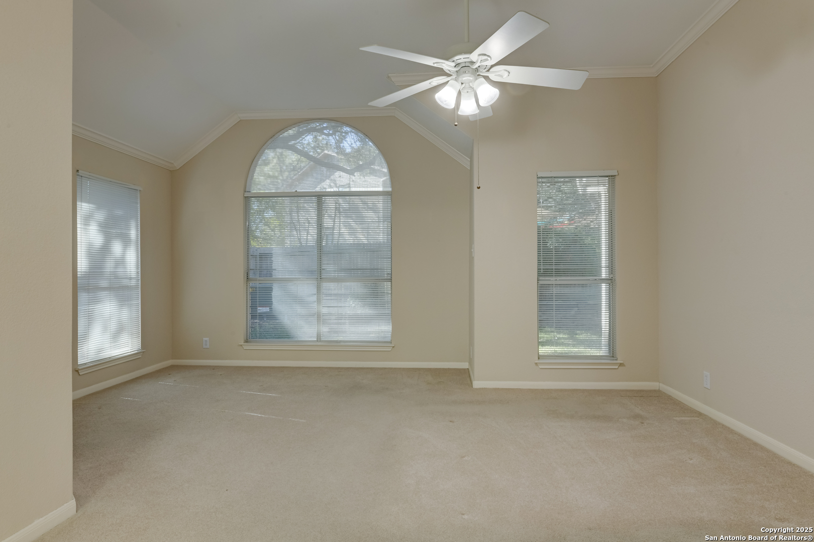 9923 Tezel Road San Antonio, TX 78254 - Photo 13 of 30 an empty room with windows and fan