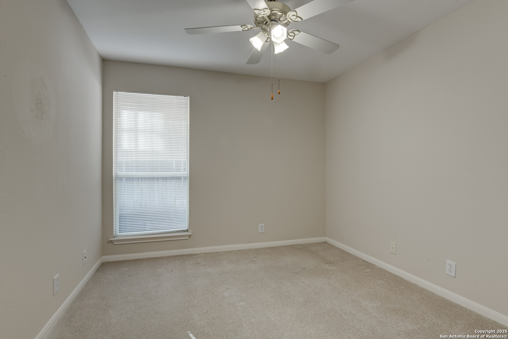 9923 Tezel Road San Antonio, TX 78254 - Photo 23 of 30 an empty room with a chandelier fan