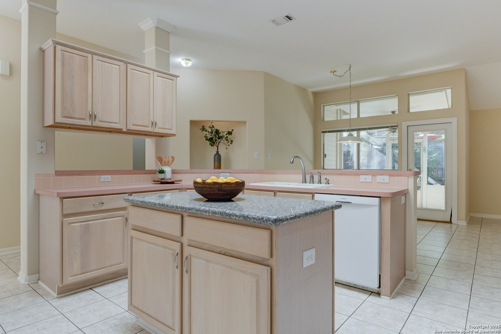 9923 Tezel Road San Antonio, TX 78254 - Photo 6 of 30 a kitchen with stainless steel appliances granite countertop a sink and a white cabinets